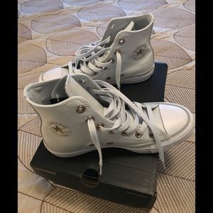 Converse Chuck Taylor All Star leather sneakers.